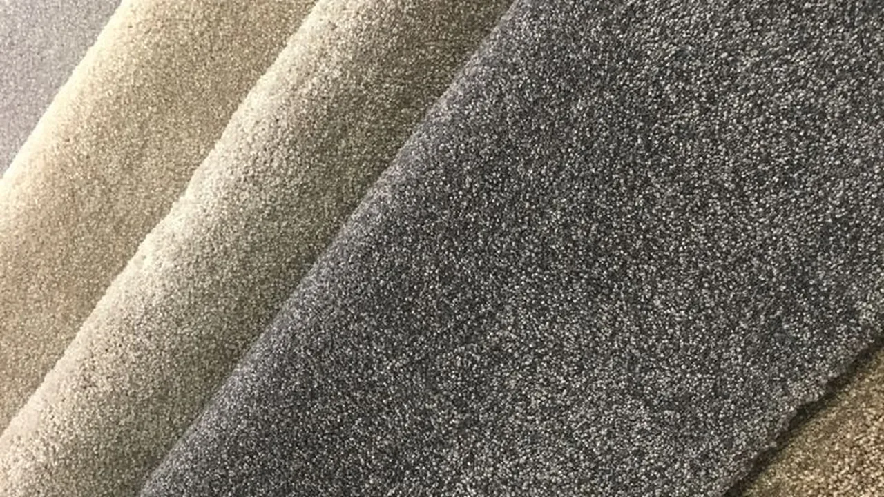 Cut pile carpet samples in beige, taupe and charcoal grey